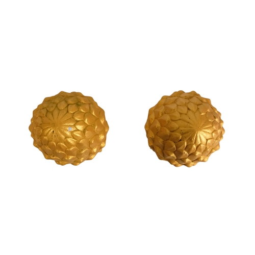 110 - A pair of cast stone finials - modelled in the form of pineapples and gilt decorated, 31cm high (2)