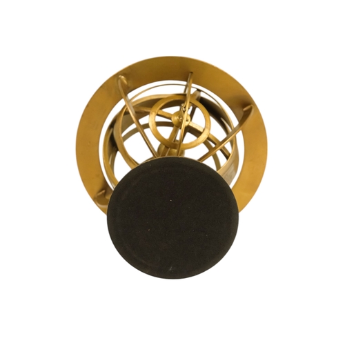 112 - A brass armillary globe - with a band engraved with signs of the zodiac, 27cm high