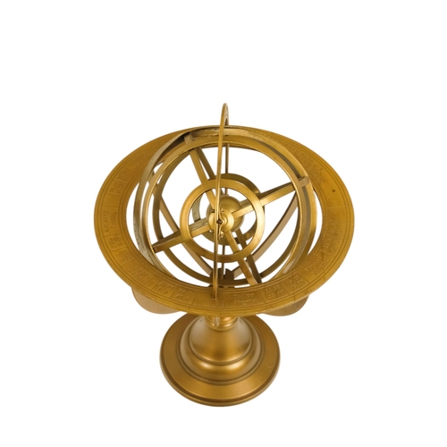 112 - A brass armillary globe - with a band engraved with signs of the zodiac, 27cm high