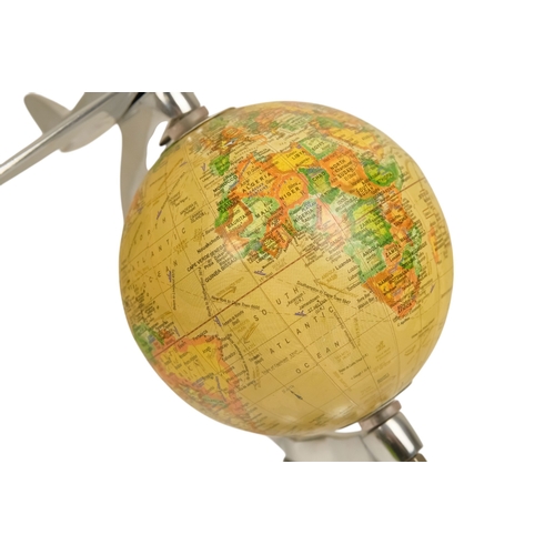 113 - A contemporary globe - surmounted by an aircraft, 25cm high