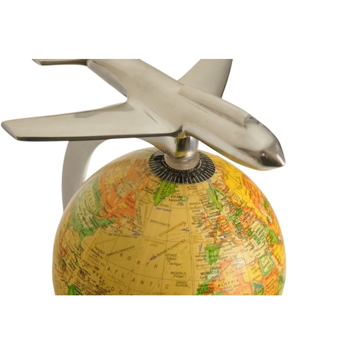 113 - A contemporary globe - surmounted by an aircraft, 25cm high