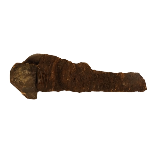 117 - An African fetish - wraped in cloth with twine, 42cm long, together with a carved hardwood palque, d... 