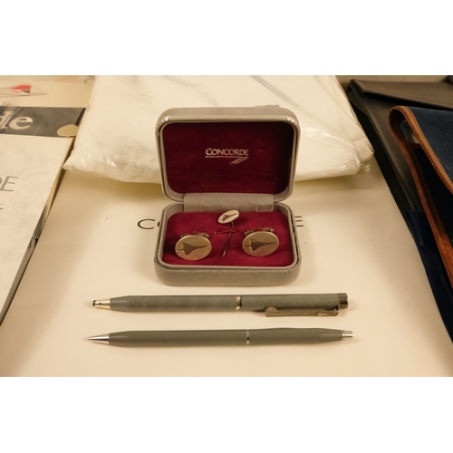 17 - A quantity of Concorde ephemera - including cufflinks, a silver picture frame, writing paper with en... 
