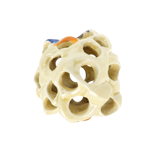 201 - A Clarice Cliff crocus pattern flower brick - painted in colours, printed facsimile signature mark t... 