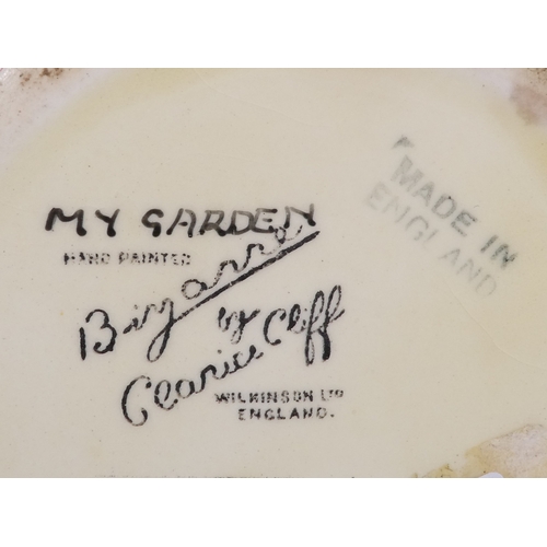 201 - A Clarice Cliff crocus pattern flower brick - painted in colours, printed facsimile signature mark t... 