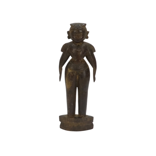 23 - A pair of 19th century African carved hardwood figures - male and female, 23cm high.