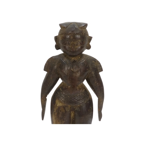 23 - A pair of 19th century African carved hardwood figures - male and female, 23cm high.