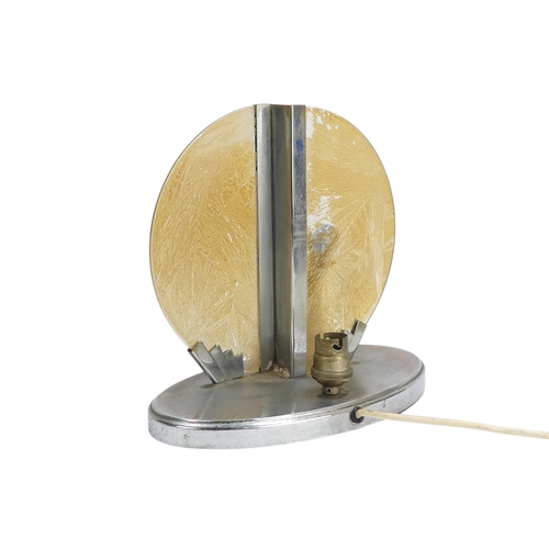26 - An Art Deco chrome and glass table lamp - modelled with a kneeling figure before a yellow disc, 22cm... 