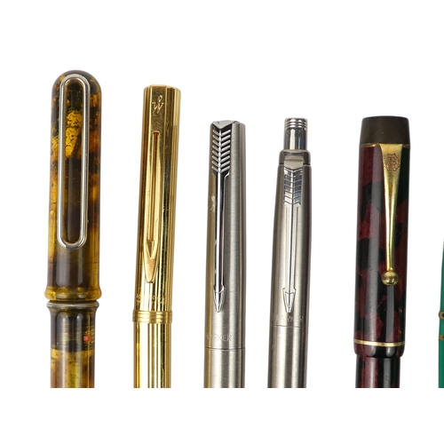 4 - A collection of writing tools - including various Parker fountain pens.