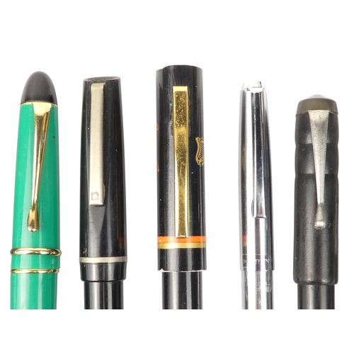 4 - A collection of writing tools - including various Parker fountain pens.