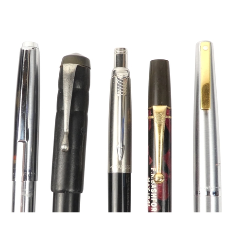 4 - A collection of writing tools - including various Parker fountain pens.