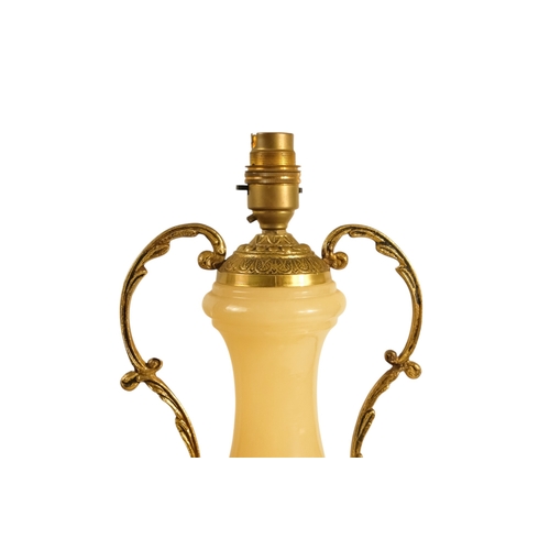 42 - A pair of alabaster and gilt metal table lamps - with twin handles and foliate castings, 58cm high. ... 