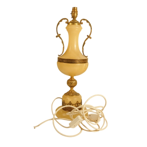 42 - A pair of alabaster and gilt metal table lamps - with twin handles and foliate castings, 58cm high. ... 