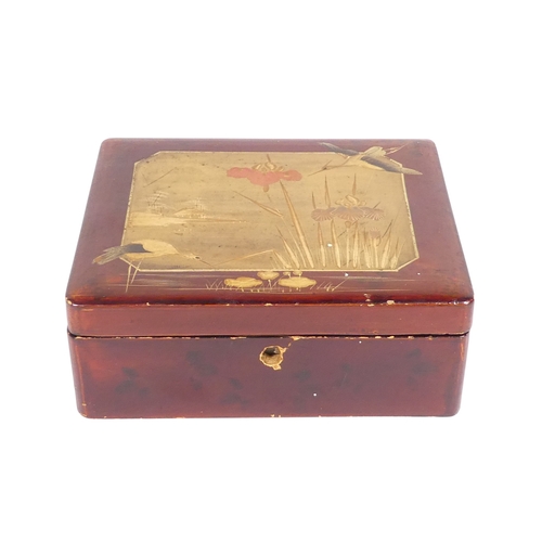 49 - An early 20th century Japanese lacquer box - decorated in gilt with crane and lake with bullrushes, ... 