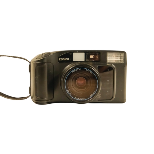 63 - An Olympus XA2 35mm camera - with a flash extension, together with three further cameras.