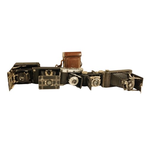 66 - A collection of early 20th century folding cameras - including Kodak examples.