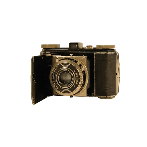 66 - A collection of early 20th century folding cameras - including Kodak examples.