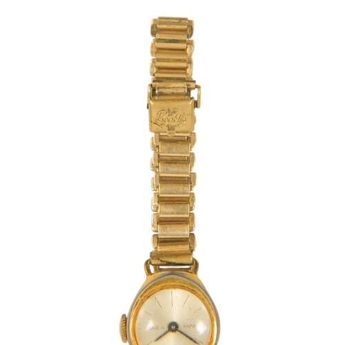 719 - A Orvin cocktail watch - the gilt dial set out with baton numerals, on a Bonklip adjustable strap.