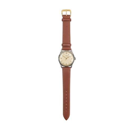 720 - A gentlemans steel cased wristwatch - the cream dial set out with Arabic numerals and batons, on an ... 