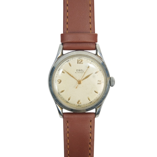 720 - A gentlemans steel cased wristwatch - the cream dial set out with Arabic numerals and batons, on an ... 