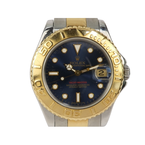 722 - Rolex Yachtmaster mid-size wristwatch - with a blue dial on a bi colour Oyster bracelet, model 16628... 