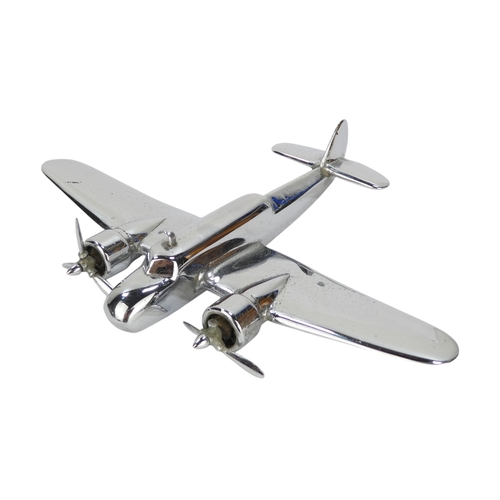 79 - A chrome aircraft desk weight - modelled as a Bristol Beaufort, 15cm long, together with two Corgi c... 