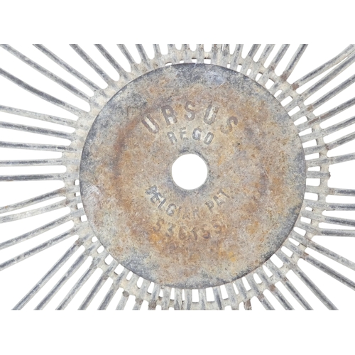 86 - A vintage wire basket - with twin handles to the rim and of tapering circular form, 37cm high.