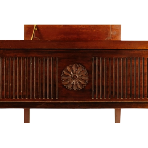 921 - An Edwardian mahogany piano stool - with an upholstered hinged seat above a fluted frieze, on square... 