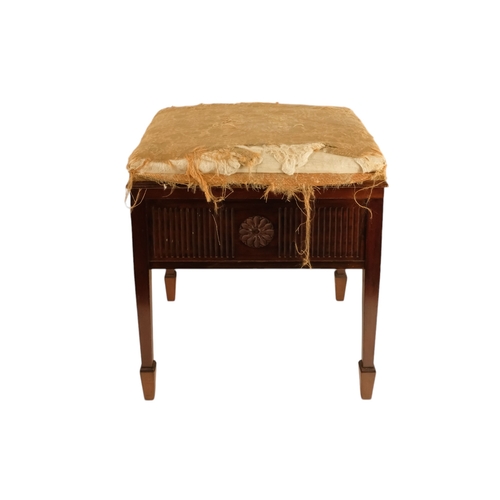 921 - An Edwardian mahogany piano stool - with an upholstered hinged seat above a fluted frieze, on square... 