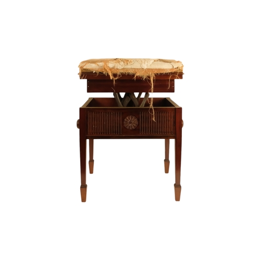 921 - An Edwardian mahogany piano stool - with an upholstered hinged seat above a fluted frieze, on square... 