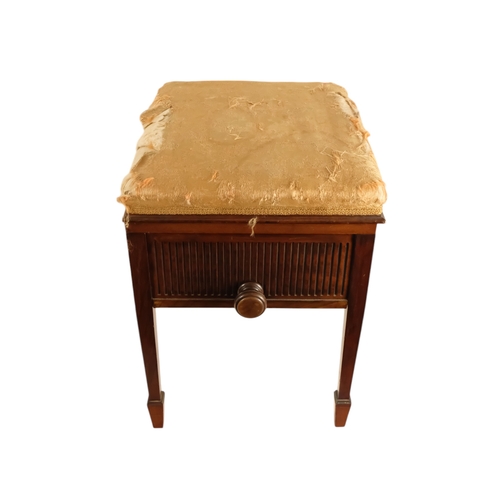 921 - An Edwardian mahogany piano stool - with an upholstered hinged seat above a fluted frieze, on square... 