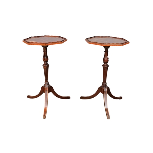 924 - A pair of George III style mahogany wine tables - the octagonal tops with a low gallery on turned an... 