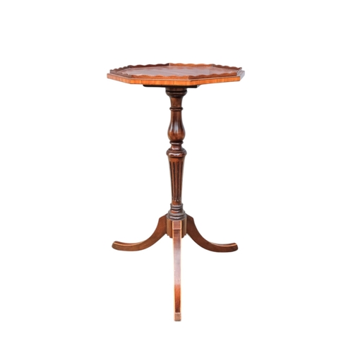 924 - A pair of George III style mahogany wine tables - the octagonal tops with a low gallery on turned an... 