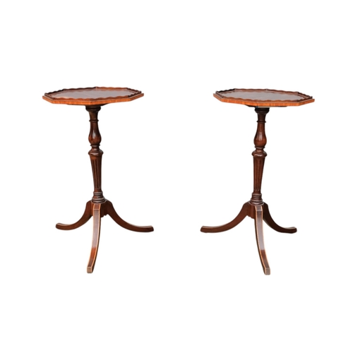 924 - A pair of George III style mahogany wine tables - the octagonal tops with a low gallery on turned an... 