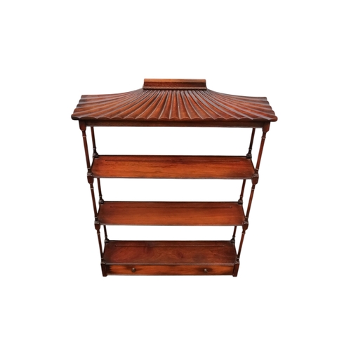 925 - A Regency style mahogany hanging wall shelf - with a pagoda canopy above three shelves with turned s... 