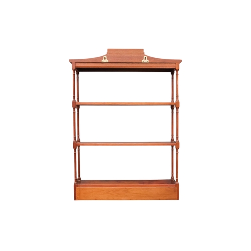 925 - A Regency style mahogany hanging wall shelf - with a pagoda canopy above three shelves with turned s... 