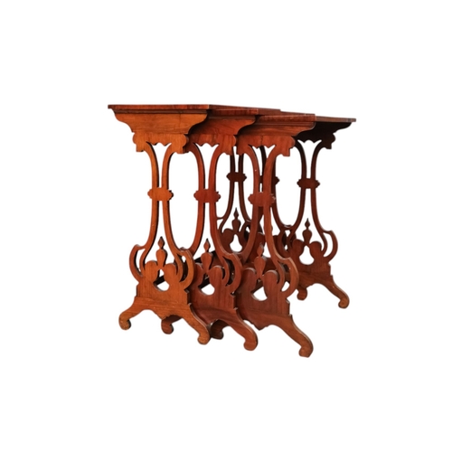 926 - A nest of three William IV rosewood tables - with rectangular tops and pierced vase shaped end suppo... 