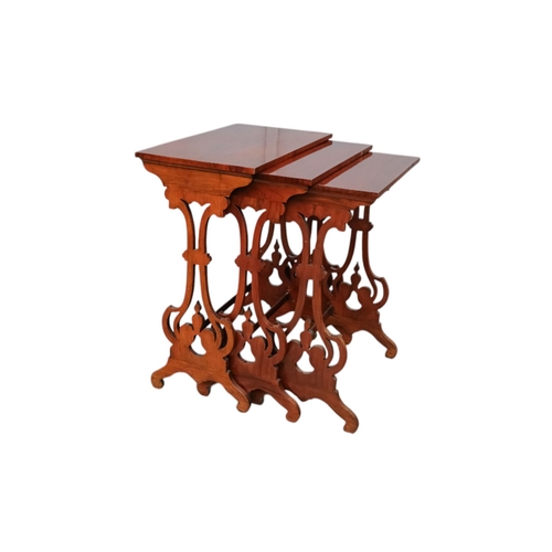 926 - A nest of three William IV rosewood tables - with rectangular tops and pierced vase shaped end suppo... 