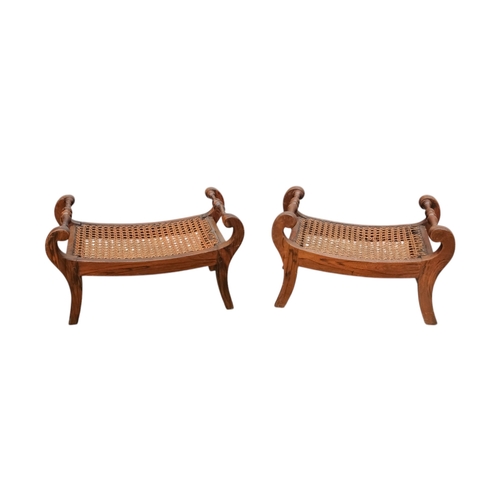 927 - A pair of 19th century mahogany footstools - the rectangular cane cushions between turned rails, on ... 