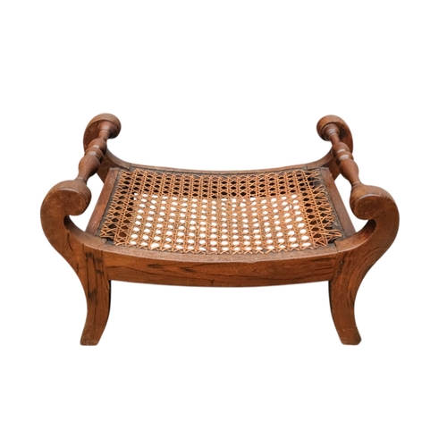 927 - A pair of 19th century mahogany footstools - the rectangular cane cushions between turned rails, on ... 