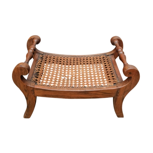 927 - A pair of 19th century mahogany footstools - the rectangular cane cushions between turned rails, on ... 