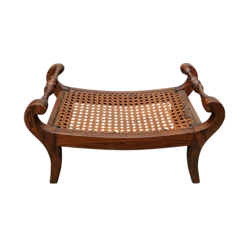 927 - A pair of 19th century mahogany footstools - the rectangular cane cushions between turned rails, on ... 