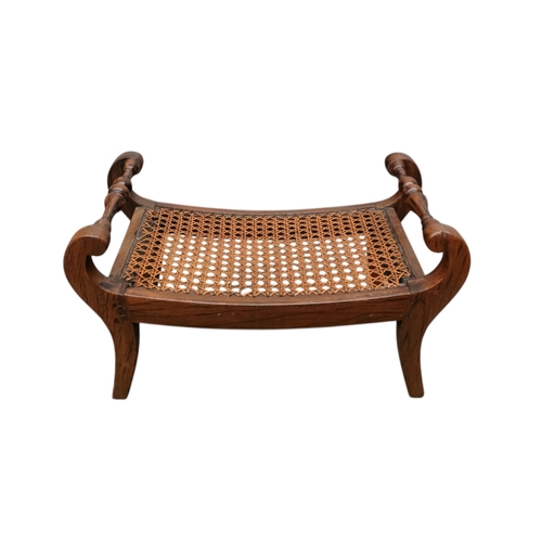 927 - A pair of 19th century mahogany footstools - the rectangular cane cushions between turned rails, on ... 