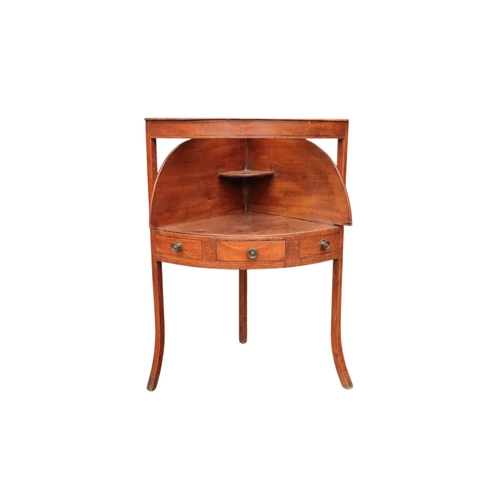 929 - A 19th century mahogany corner washstand - with a raised back incorporating a shelf, the top with th... 