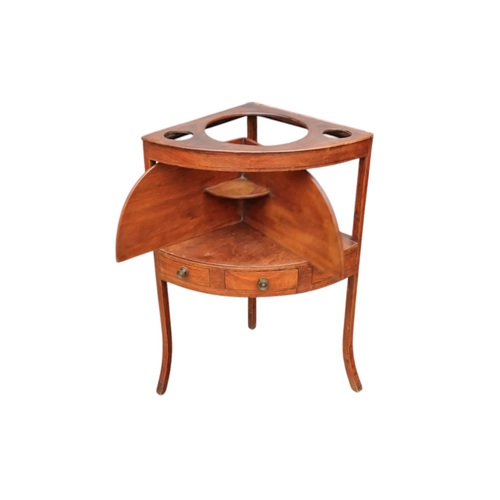 929 - A 19th century mahogany corner washstand - with a raised back incorporating a shelf, the top with th... 