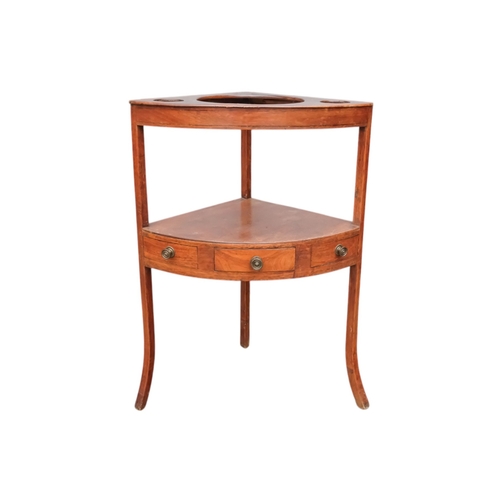 929 - A 19th century mahogany corner washstand - with a raised back incorporating a shelf, the top with th... 