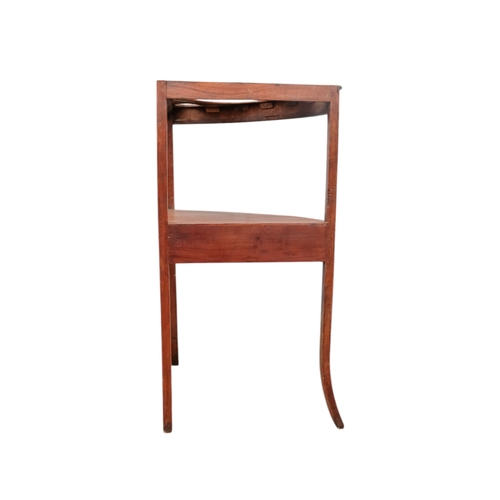 929 - A 19th century mahogany corner washstand - with a raised back incorporating a shelf, the top with th... 