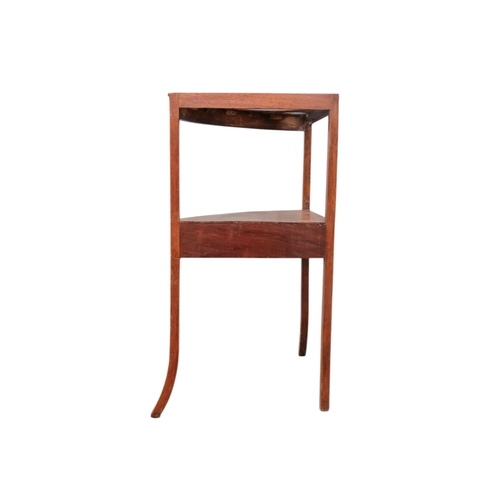 929 - A 19th century mahogany corner washstand - with a raised back incorporating a shelf, the top with th... 