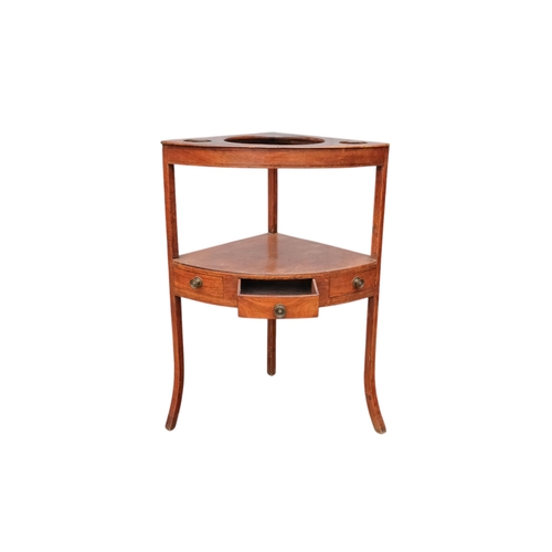 929 - A 19th century mahogany corner washstand - with a raised back incorporating a shelf, the top with th... 