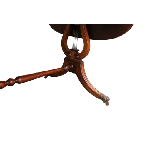 931 - A George III sytle mahogany sofa table - the rectangular top with drop ends, on lyre shaped end supp... 